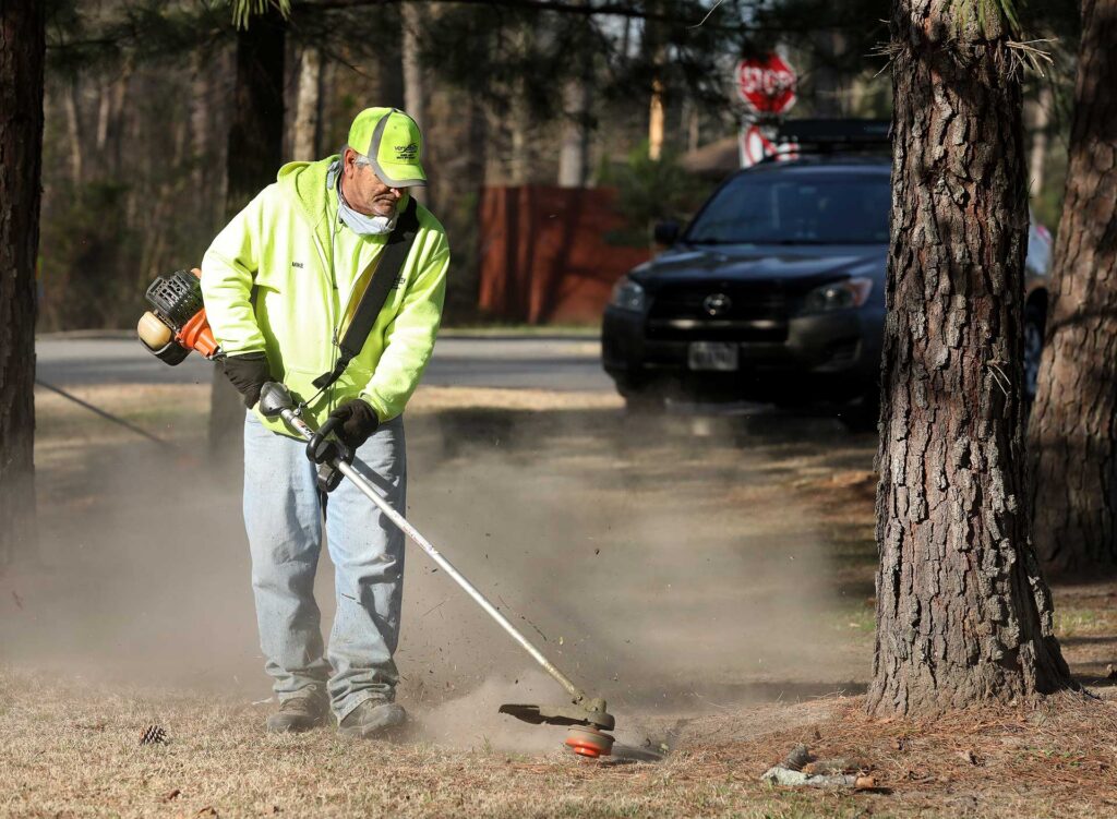 The Versability Resources lawn care crew works near the Yorktown Naval Weapons